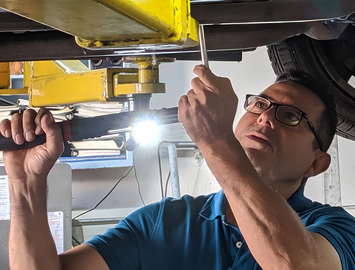 ASE-certified technician at The Real Mechanic Shop in Fullerton